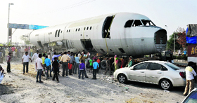 Scrap of an Airbus 320, bought by a businessman, being transported in New Delhi on Saturday.