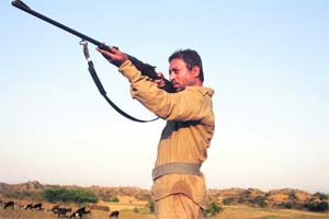 Irrfan Khan as Paan Singh Tomar, a seven-time national champion athlete and jawan who became a dacoit