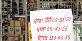 A liquor vend with its notice announcing a huge discount on prices in Muktsar.