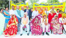 Newly-wed couples are blessed during a mass marriage ceremony at Manav Sewa Sangh in Karnal on Sunday