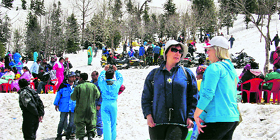 Tourists have fun at Gulaba, 21 km from Manali, on the Leh highway on Sunday.