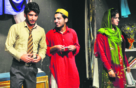 Artistes stage the play "Kabab Mein Haddi" organised by Natrang in Jammu on Sunday.