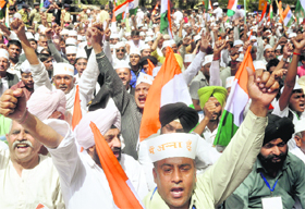 Supporters of Anna Hazare during his daylong fast near Parliament House in New Delhi on Sunday.