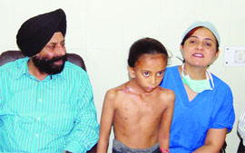 Dr Balbir Singh Dhillon, SMO, Civil Hospital, along with the patient Sandeep Kaur, who was treated, in Amritsar. 