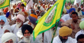 Residents of the village Burj Mehma sit on a protest against the setting up of the Common Bio-Medical Waste Treatment and Disposal Plant in their village, in Bathinda on Monday.