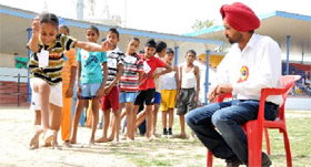 Aspirants line up to perform in a field event on Day I of the selection trial held at the Multi-purpose Stadium in Bathinda on Monday.