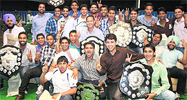 Panjab University sportspersons pose with their prizes at the annual prize distribution function in Chandigarh on Monday. 