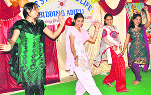 Girls perform a dance during a cultural function at a college in Bhiwani. 