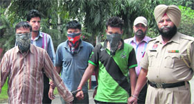 Members of an inter-state robbers' gang in police custody in Jalandhar on Monday.