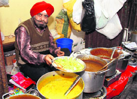 Prithvi Pal Singh serves a delicious mix of his karhi chawal recipe laced with pudine ki chatni at his little old establishment at Attari Bazaar in Jalandhar. 