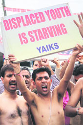 Activists of the Youth Wing of the All-India Kashmiri Samaj hold a protest in Jammu on Monday.