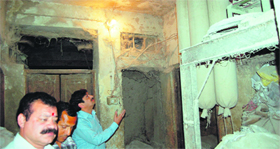 MC health officials show the unhygienic conditions inside a flour mill in Amritsar on Tuesday.