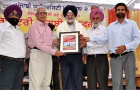 Dr SS Tiwana, Dean (Academic Affairs), Punjabi University, Patiala, being honoured at the valedictory session of the national conference organised at the Punjabi University Regional Centre in Bathinda on Tuesday