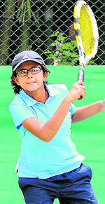 A player plays a shot during a tennis match in Chandigarh
