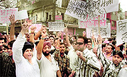 Striking jewellers stage a demonstration in support of their demands in Dehradun on Tuesday