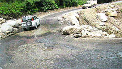 A damaged part of the National Highway at Pandoh, near Mandi. 