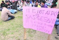 Students of the University of Kashmir hold a protest