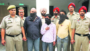 Members of the auto-rickshaw gang in police custody in Ludhiana on Tuesday. 