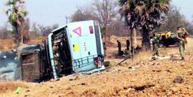 Security personnel inspect the site where 15 CRPF personnel were killed in a Maoist attack in Maharashtra on Tuesday.