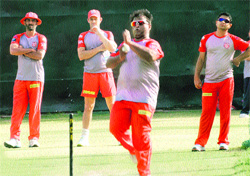 Vikram Rathore, Adam Gilchrist, captain-cum-coach, Ramesh Powar and Piyush Chawla practise at the PCA Stadium in Mohali on Wednesday.
