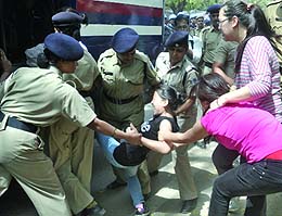 Tibetan activists being detained by the Delhi police during a protest against the visit of Chinese President Hu Jintao in New Delhi on Wednesday.