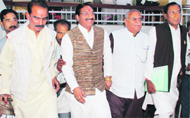 Senior BJP legislators, including former Chief Minister Ramesh Pokhriyal Nishank, come out of the Vidhan Sabha after staging a walkout in Dehradun on Wednesday.