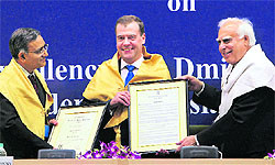 Union HRD Minister Kapil Sibal confers Doctor of Philosophy (honoris causa) of Jawaharlal Nehru University upon Russian President Dmitry Medvedev in New Delhi on Wednesday. JNU VC Sudhir K Sopory can also be seen
