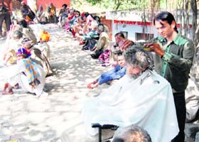 Beggars being given a haircut at the shelter home in Old Karam Singhwala Ward of Amritsar on Thursday