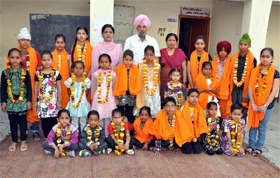 The meritorious students of Dashmesh Public School being honoured for excelling at studies in Bathinda.