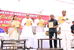 Chief Minister Bhupinder Singh Hooda releases the souvenir of Sonepat Cooperative Bank in Sonepat. 