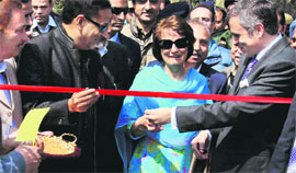 Chief Minister Omar Abdullah urges his mother Molly Abdullah to cut the ribbon to declare open the garden.