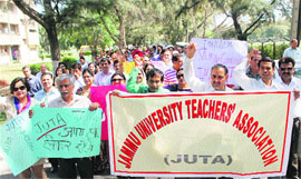 Members of the Jammu University Teachers Association hold a protest rally in support of their demands at the University of Jammu on Thursday.