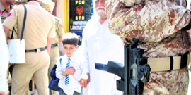 A schoolboy returns home in Patialas heavily guarded Arya Samaj area.