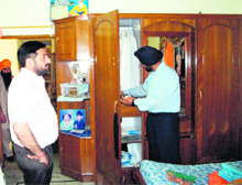 A police team looks for clues after the robbery incident at the residence of Inspector Sujit Singh in Amritsar on Friday.
