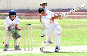 A batsman plays a shot during a match at DAV School, Sector 8, in Chandigarh, on Friday. 