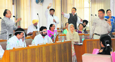 Councillors argue during the General House of the municipal corporation at Sector 17 in Chandigarh on Friday.