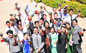 Students of the Chandigarh Institute of Hotel Management and Catering Technology pose with their prizes on their annual function on Friday.