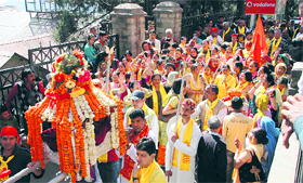 Devotees take part in a religious procession during the Navratri festival in Shimla on Friday.
