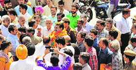 Supporters of newly-elected MLC Jugal Kishore Sharma garland him on his arrival at Pouni in Reasi on Friday.