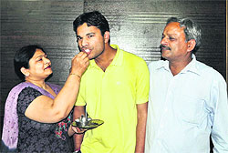 Himanshu Gupta, who has secured All-India 5th rank in the Indian Forest Services exam, with father Ravi Kumar Gupta and mother Mamta Rani in Ludhiana