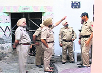Police personnel outside the complainant's house