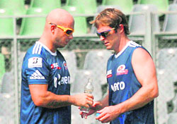 Mumbai Indians Herschelle Gibbs (L) with fielding coach Jonty Rhodes at a practice session at the Wankhede Stadium in Mumbai on Friday