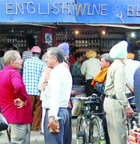 Crowd outside a liquor vend in Amritsar on Saturday.