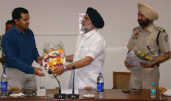 Deputy Commissioner Kamal Kishore Yadav greets Punjab Education and Languages Minister Sikendar Singh Maluka during a meeting of the district officers of various departments in Bathinda on Saturday. SSP Sukhchain Singh Gill (right) is also seen in the picture. 