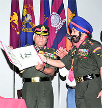 The Army Chief, Gen VK Singh, releases A Coffee Table Book of 1 Guards at a function at Roorkee on Saturday