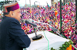 Chief Minister Prem Kumar Dhumal addresses a gathering at a womens awareness camp organised by the Himachal Pradesh State Women Commission at Manali on Saturday