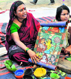 Moyna Chitrakar, a patua artist, specialises in scroll painting