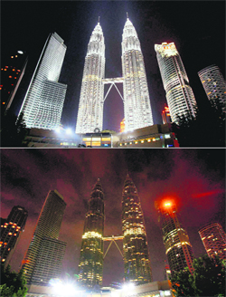 This combination photo shows Malaysias Petronas Twin Towers before (top) and after the lights were turned off to mark Earth Hour in Kuala Lumpur 