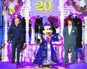 Mickey is flanked by former international soccer player Zinedine Zidane (L) and Phillipe Gas, president of Euro Disney at Disneylands theme park in Marne-la-Vallee, Paris, on Saturday
