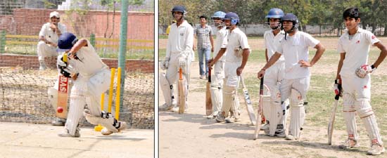 (Right) Players await their turn while one (left) performs during the selection trial for PCAs cricket training camp slated to begin on May 7, at the Police Public School, Police Lines, Bathinda, on Sunday